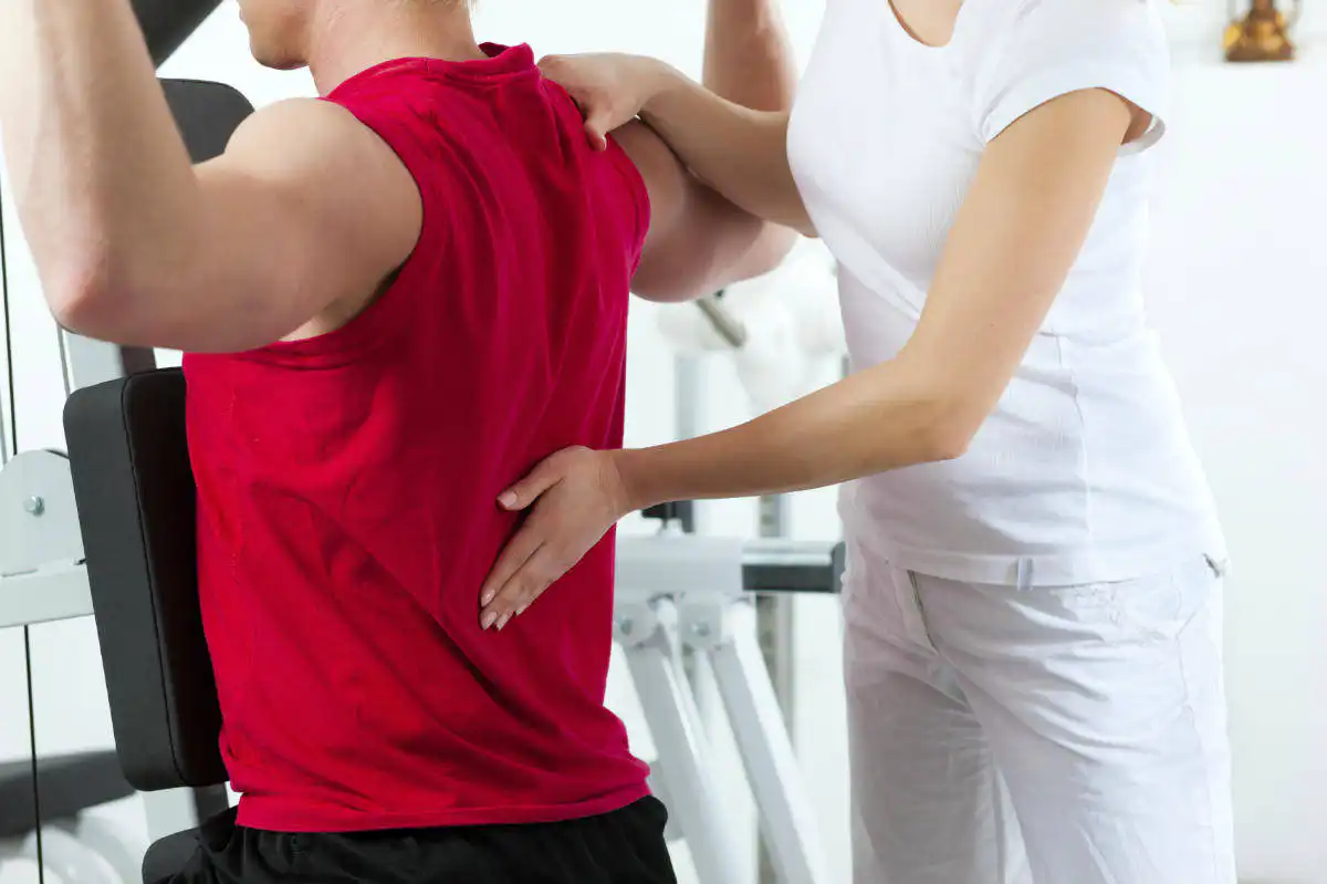 Injured Missouri worker in physical therapy for a back injury after being declared at MMI