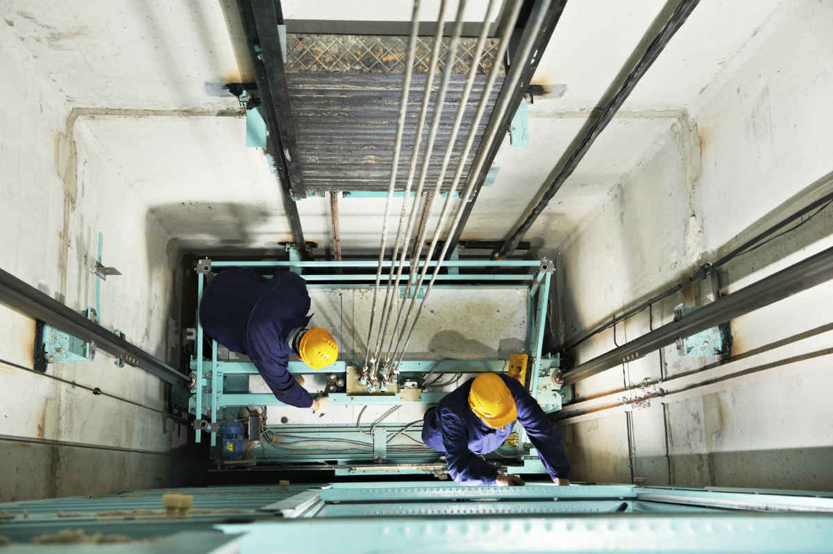 St. Louis workers in an elevator shaft