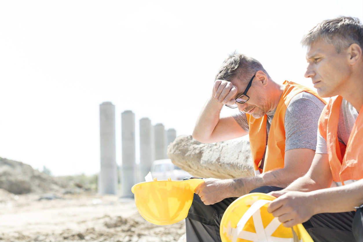 two construction workers in the sun