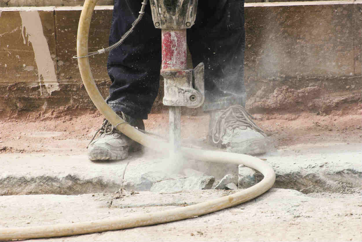 St. Louis workers operating jackhammer