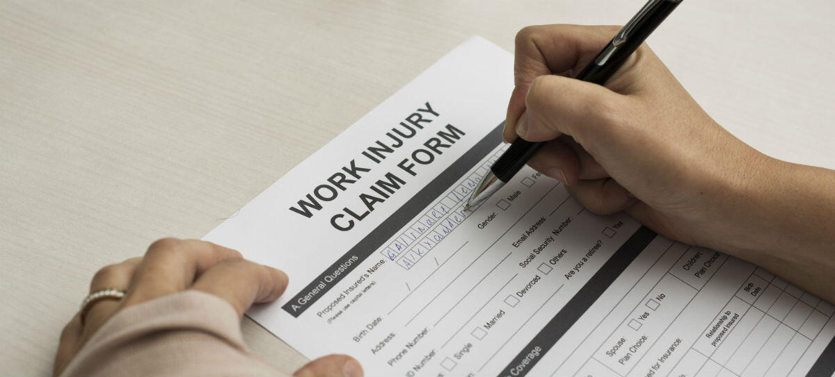woman filing out work injury form