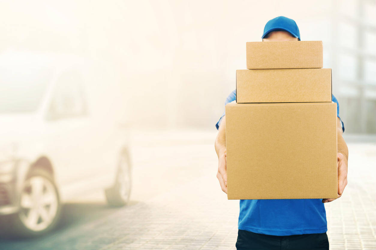 delivery man carrying boxes