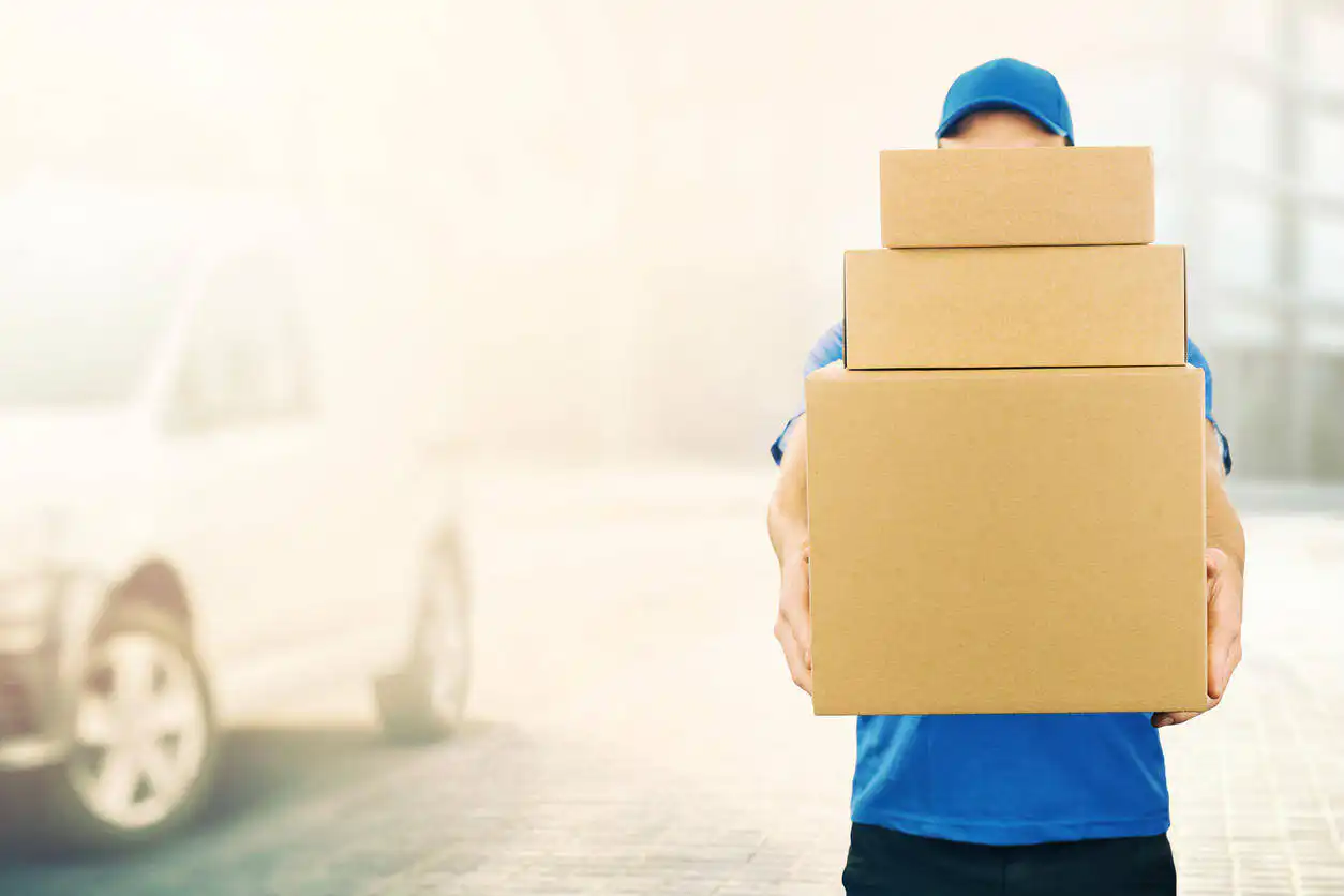 delivery man carrying boxes