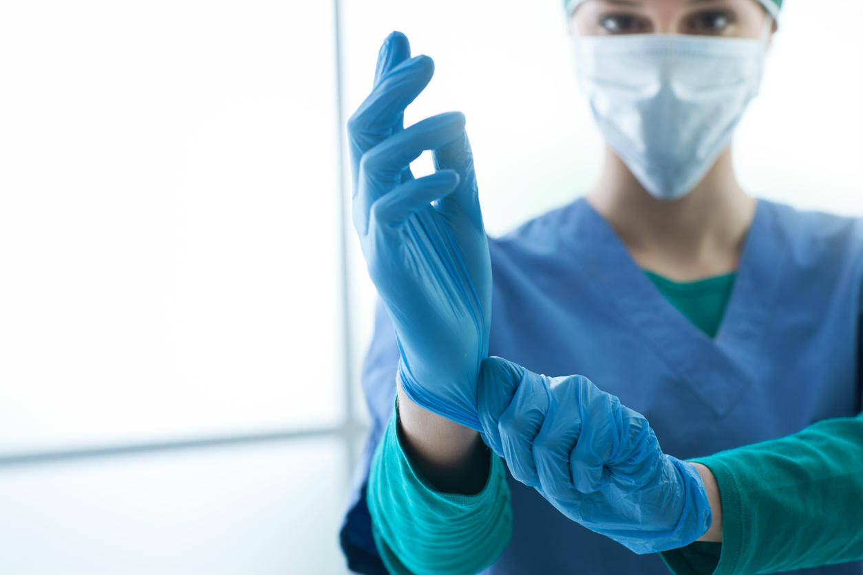 medical worker with mask and gloves