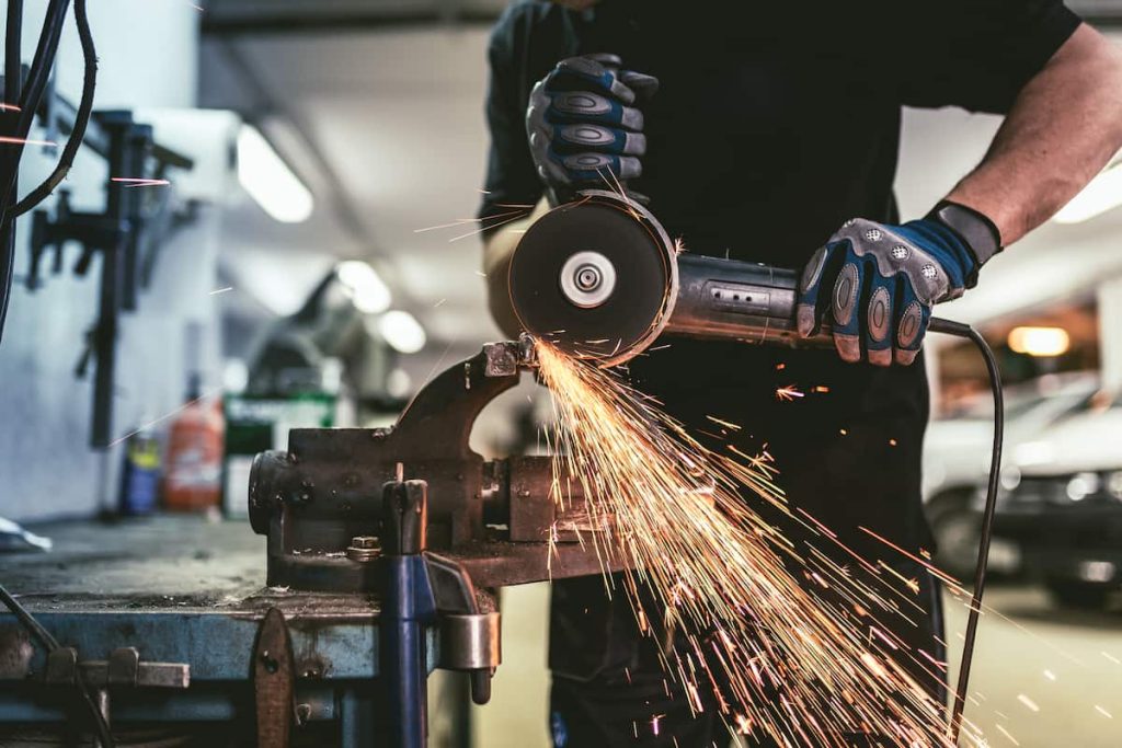 missouri worker cutting steel with grinder