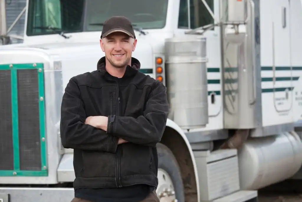 truck driver in front of his truck