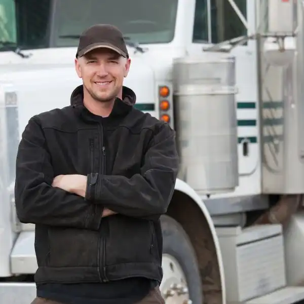 st. louis truck driver in front of his truck