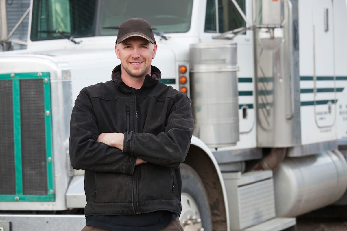 st. louis truck driver in front of his truck