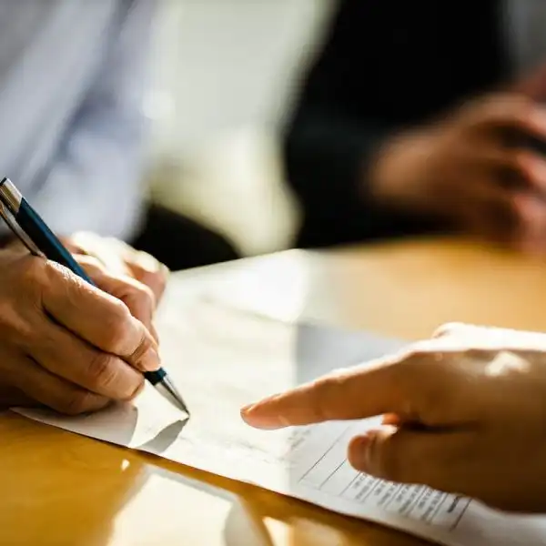 injured worker signing a settlement offer