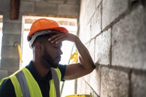 exhausted male construction worker