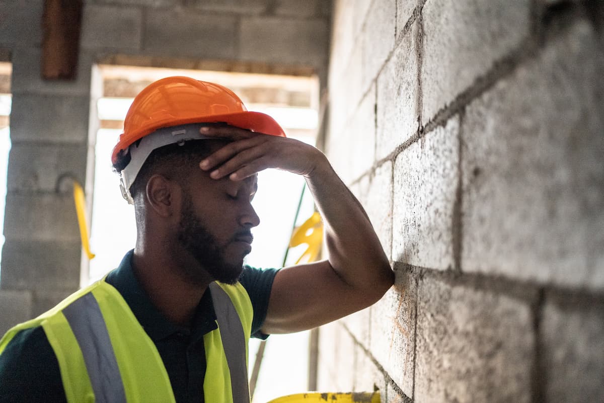 exhausted male construction worker