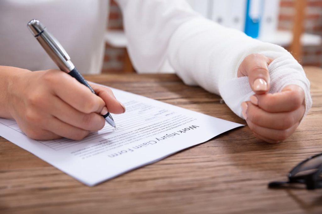 injured worker filling out paper work