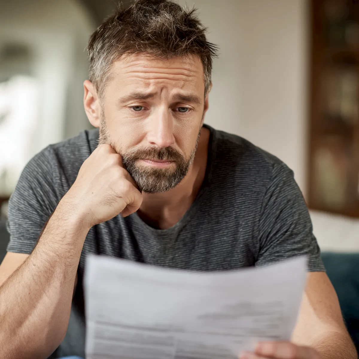 Missouri worker reading a workers’ compensation denial letter