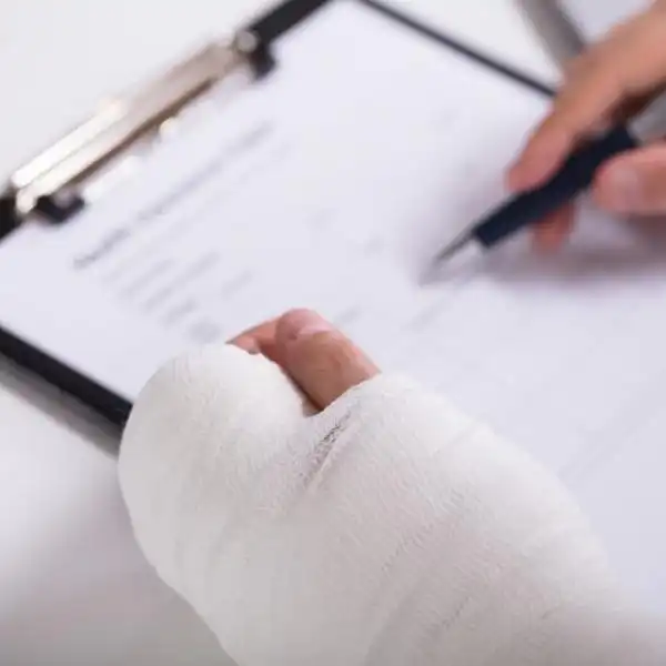 injured working filling out injury report