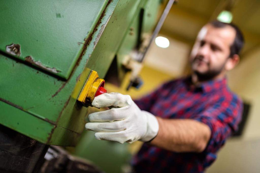 st. louis man turning on industrial machine