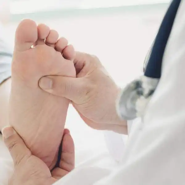 having foot examined by a doctor