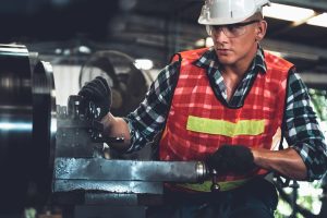 st. louis worker using a machine at work