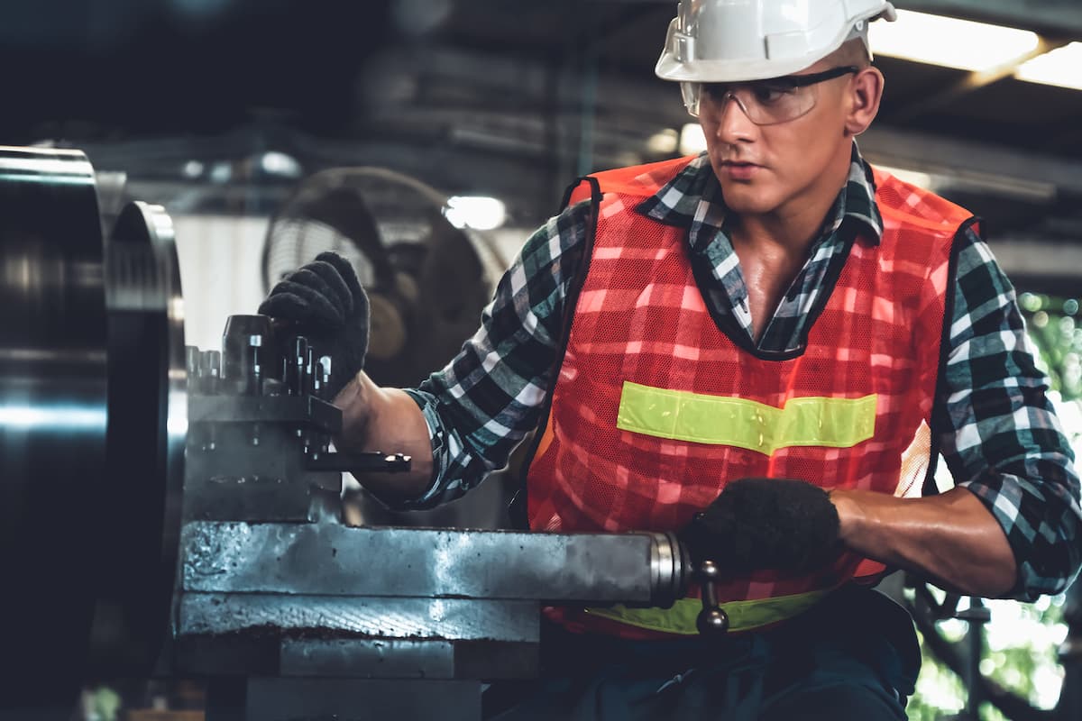 st. louis worker using a machine at work