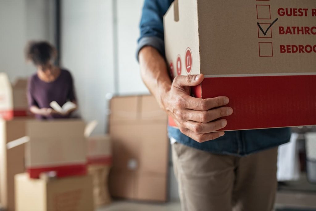 man carrying moving box