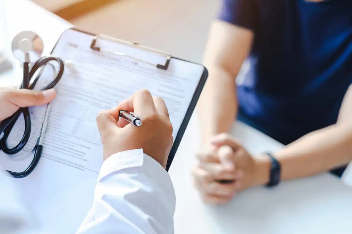 Doctor documenting permanent work restrictions after a Missouri work injury
