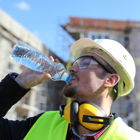 construction worker drinking water