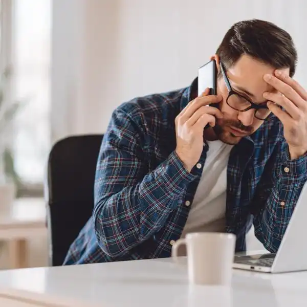 man on the phone with insurance company