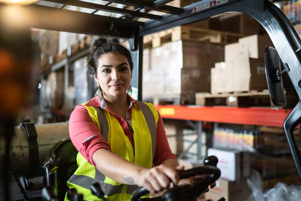 Warehouse worker moving freight on a loading dock