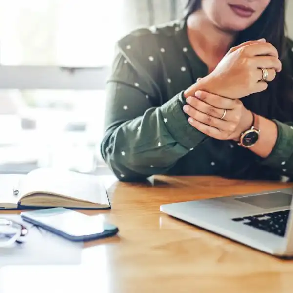 st. louis woman working from home with wrist pain
