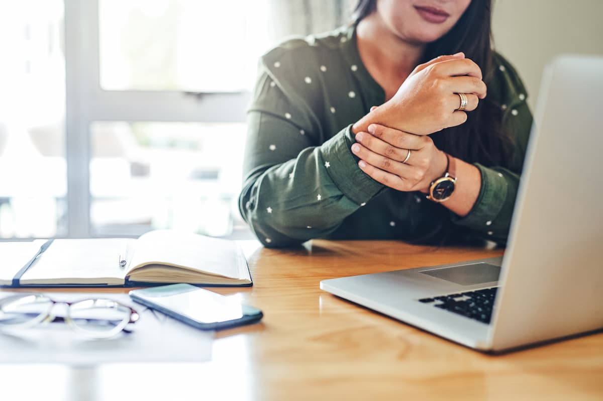 st. louis woman working from home with wrist pain