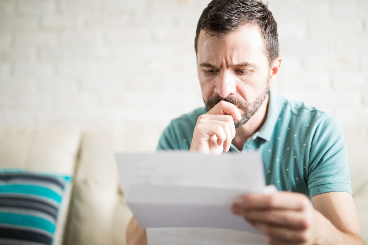 injured worker looking at insurance denial letter