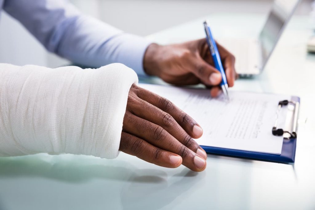 injured worker filing out workers comp paperwork