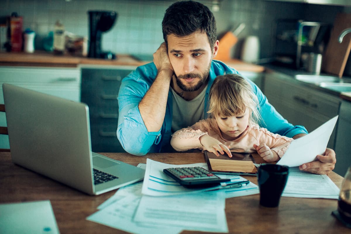 stressed injured worker reviewing insurance documents