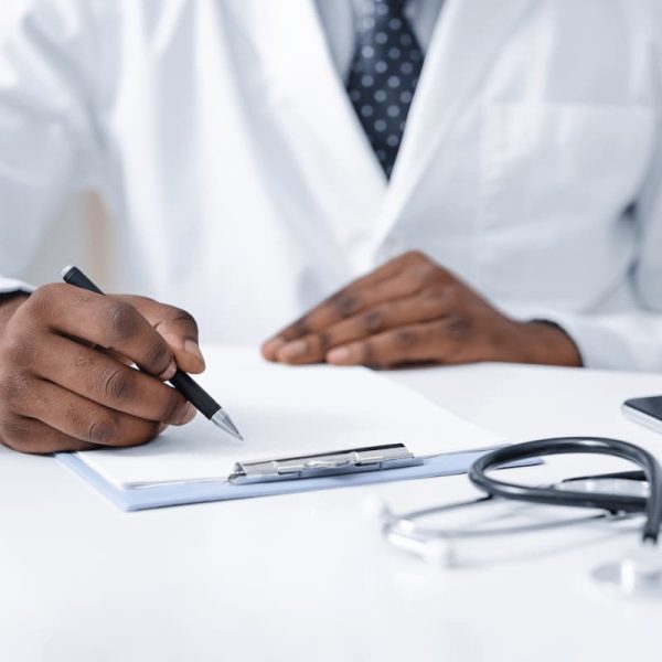 workers compensation doctor making notes